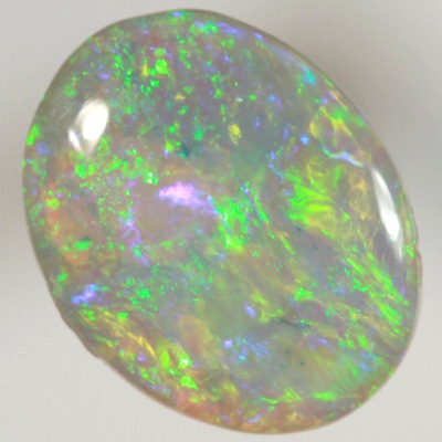 SOLID CRYSTAL OPAL Bright sparkles of greens throughout a purple hue